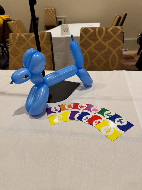 Even “finished” games can be improved. I introduced 99 Balloons to 12 groups of people at @breakoutcon this weekend! It was both fun, and insightful!

After running 9 tournaments, and solely acting as the balloonist (running the central market) I realized this should be a separate role. I’ve played the game many times now, but I’ve always run the table AND played. It’s challenging, to say the least. 

As a dedicated balloonist, I can choose which colour to play into the market, and mess with the other players! This role can now be separated, and rotates each round. No more juggling, and agency for all players. I’ll be changing the rules for everyone to enjoy.

I’m extremely thankful to have had the opportunity to run these tournaments and continue to improve the game. Also, I’m thankful that my rules are accessed via a QR code so that all players can now enjoy the new way to play!

#boardgamerules #rules #boardgamedev